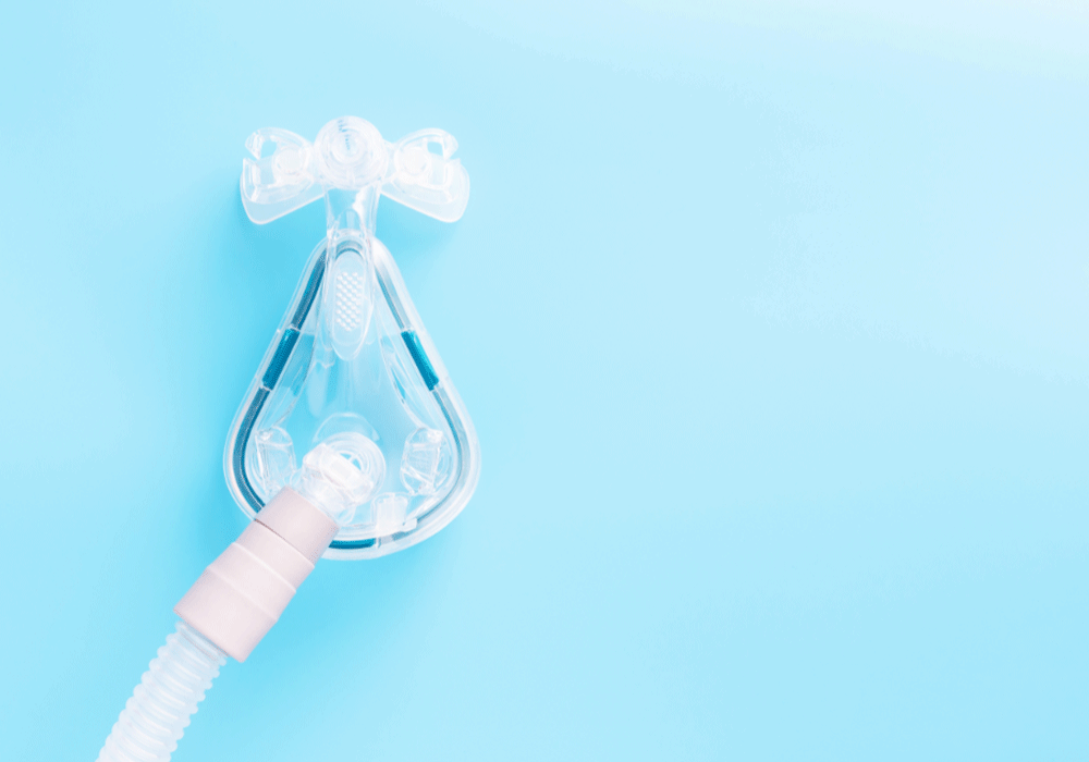 CPAP mouthpiece on light blue background