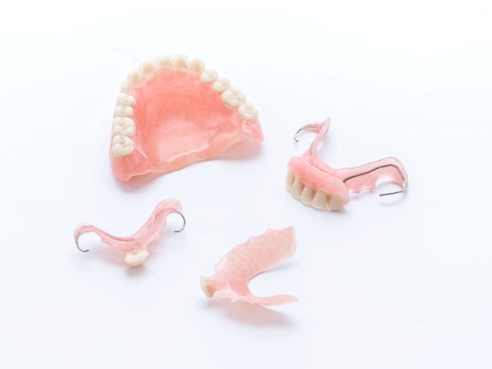 various denture types on a white background